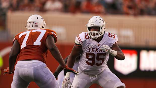 Texas defensive lineman Alfred Collins (95) rushes the quarterback during Texas's annual spring football game at Royal Memorial Stadium in Austin, Texas on April 23, 2022.